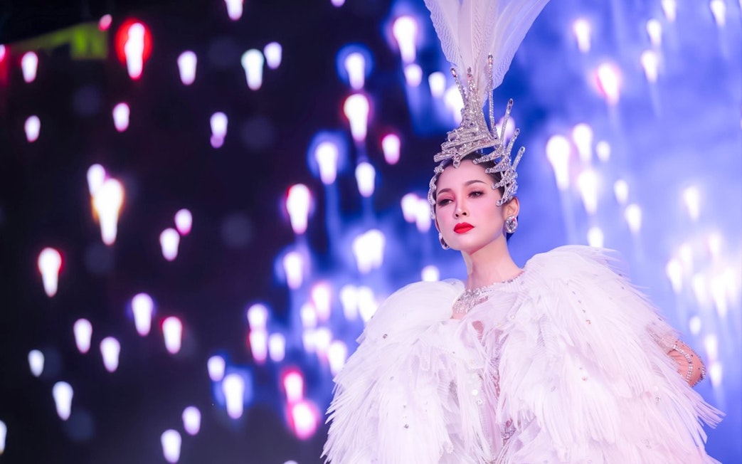Performer in elaborate costume at Calypso Cabaret, Bangkok.
