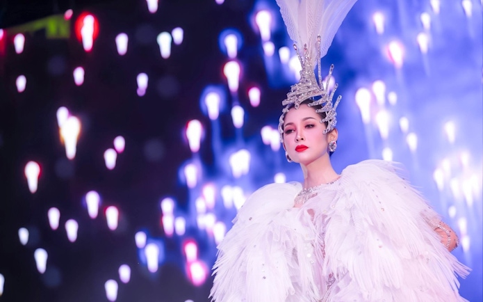 Performer in elaborate costume at Calypso Cabaret, Bangkok.