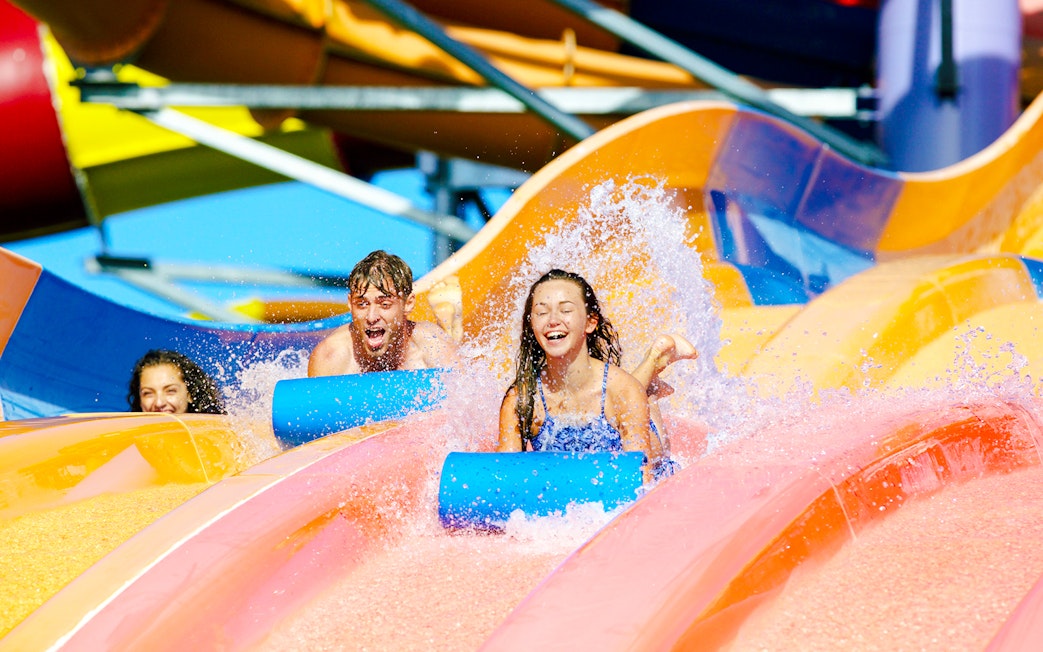 Children enjoying waterslides at Whitewater World, Gold Coast.