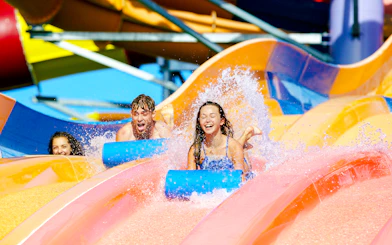Children enjoying waterslides at Whitewater World, Gold Coast.