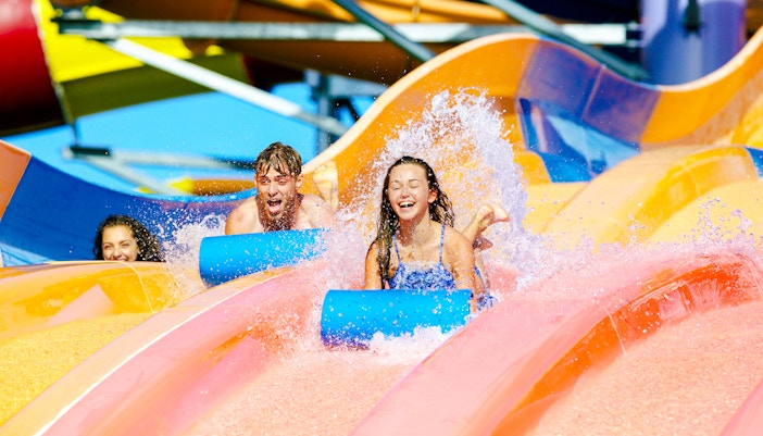 Children enjoying waterslides at Whitewater World, Gold Coast.