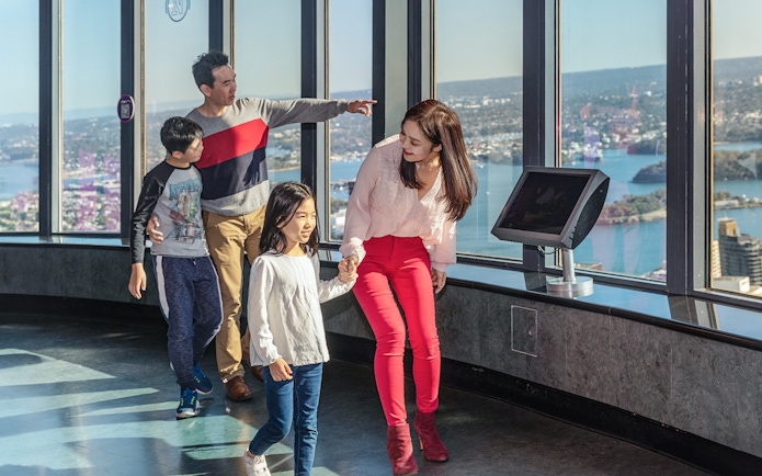 Family enjoying the view from Sydney Eye Tower observation deck.