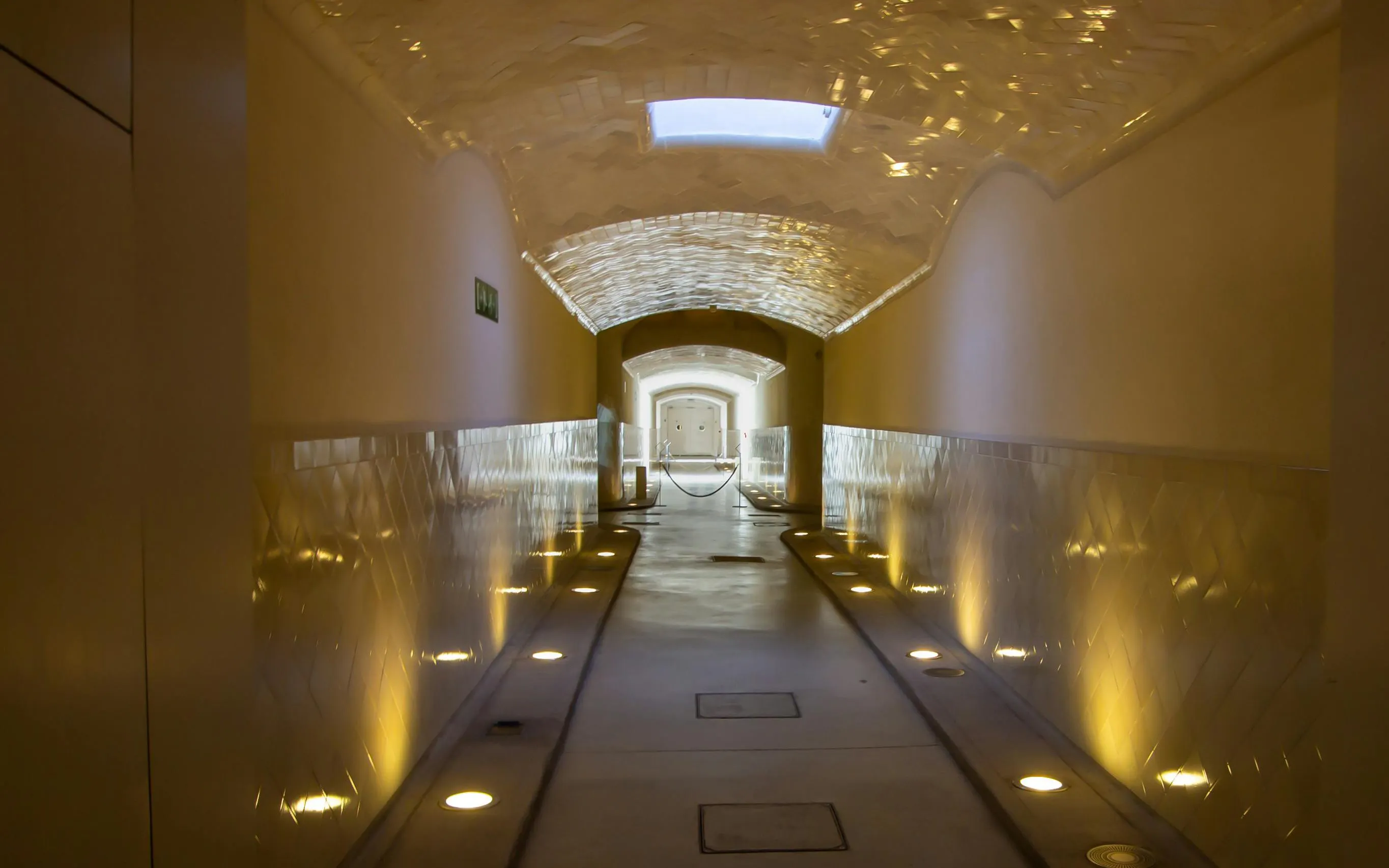 Underground tunnel with illuminated walls at Modernist Site of Sant Pau, Barcelona.