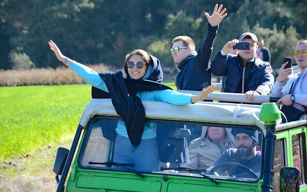 Tourists enjoying a jeep ride during the Full-Day Guided Tour of Kekova Sunken City, Demre & Myra.