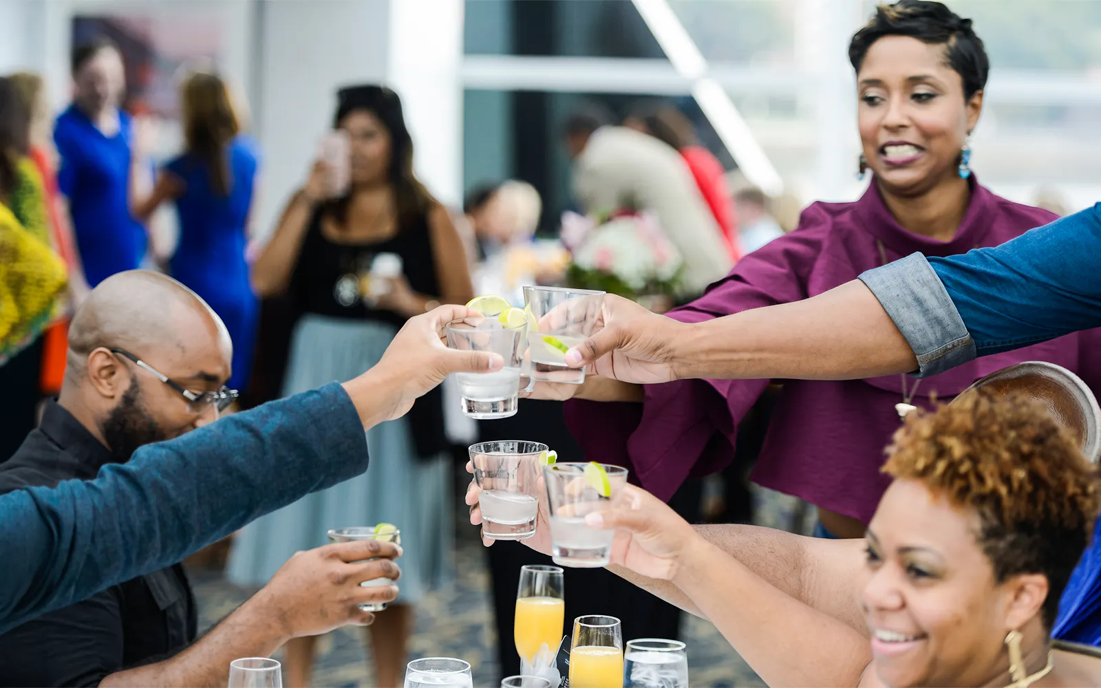 Guests toasting with drinks on a brunch cruise in Washington DC.