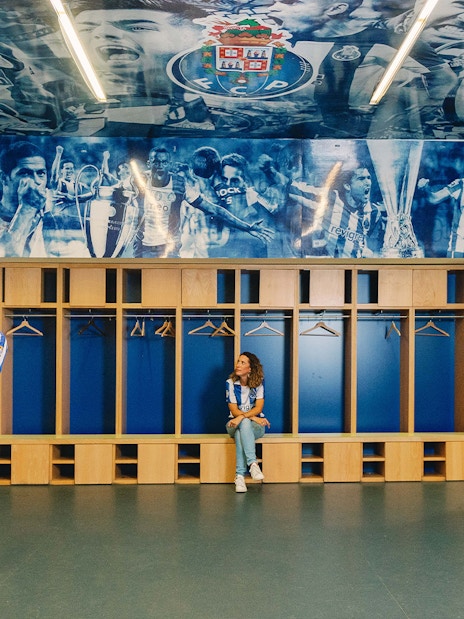 Visitors exploring FC Porto stadium museum dressing room.