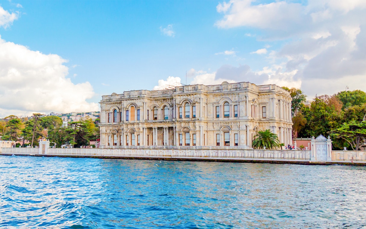 Beylerbeyi Palace by the Bosphorus in Istanbul, surrounded by water and greenery.