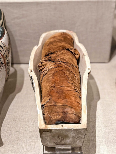 Mummy and sarcophagi at the National Museum of Egyptian Civilization in Cairo.