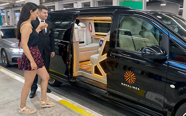 Private transfer service at Sabiha Gokcen Airport, Istanbul, with luxury van and driver.