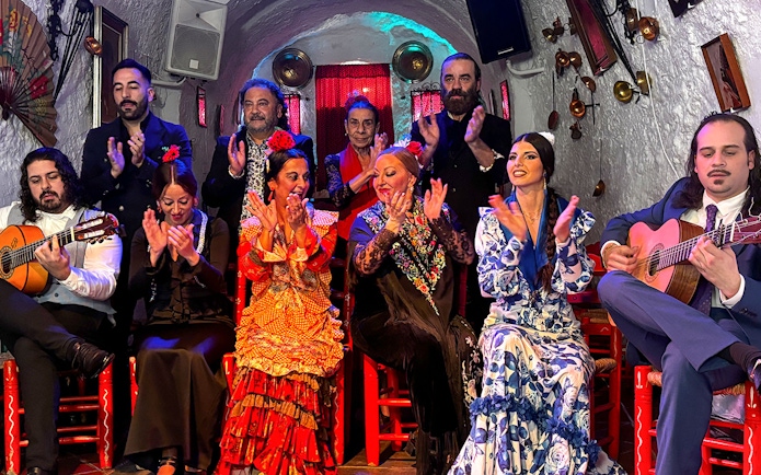 Flamenco dancers and musicians performing at Flamenco Cuevas Los Tarantos, Granada.