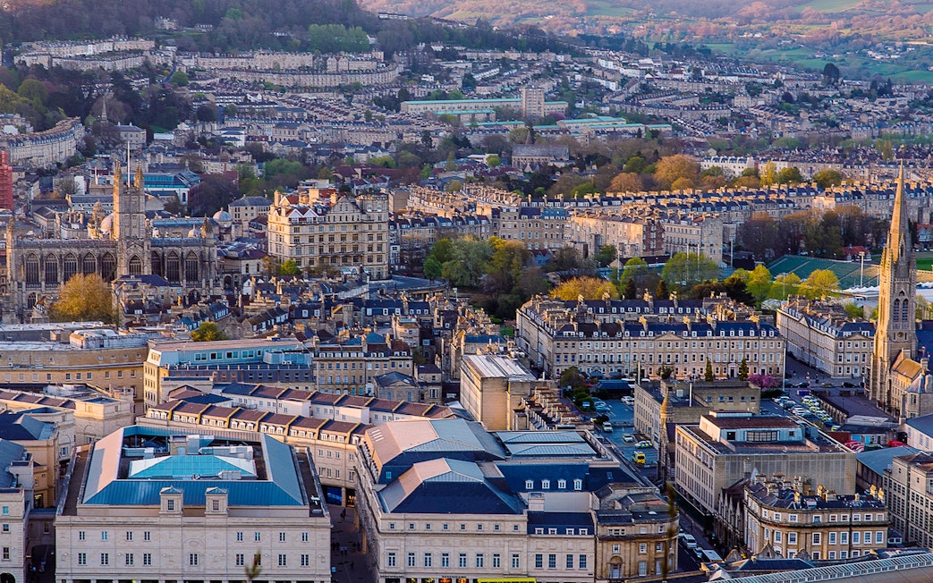 Aerial view of Bath, featuring Bath Abbey and surrounding Georgian architecture.