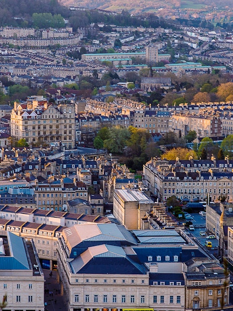 Aerial view of Bath, featuring Bath Abbey and surrounding Georgian architecture.