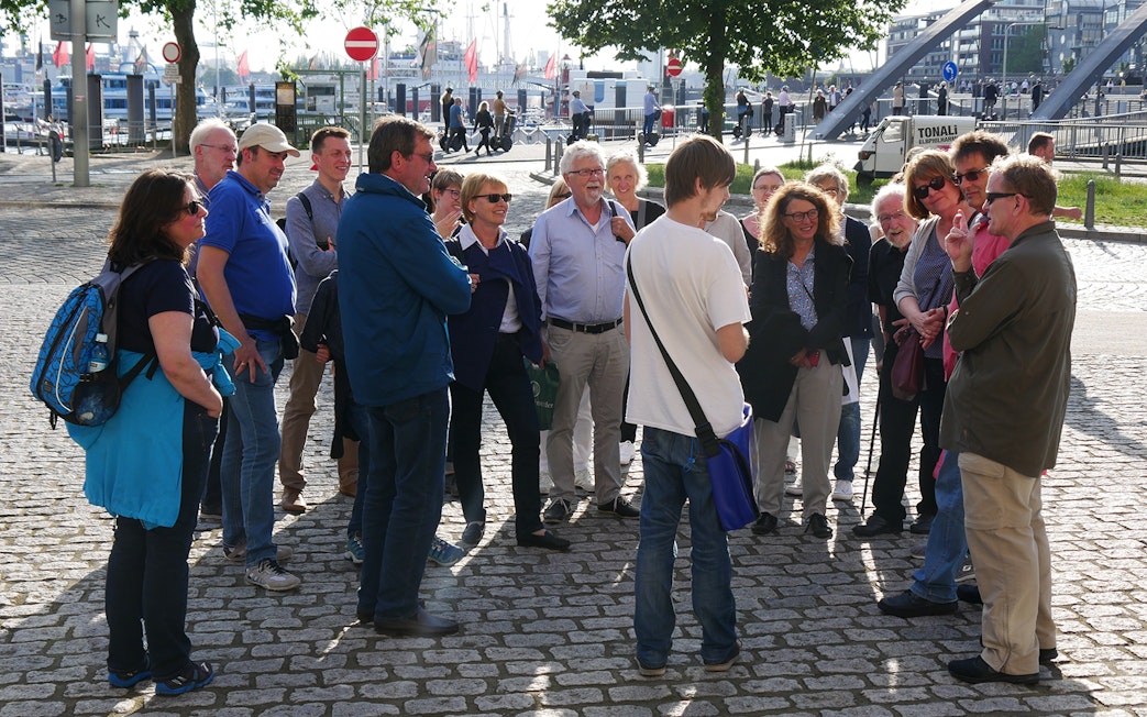 Group listening to a guide during Elbphilharmonie tour in Hamburg.