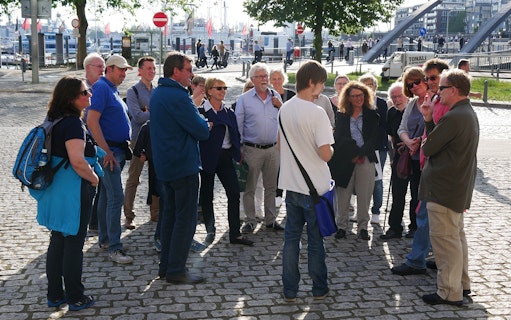 Group listening to a guide during Elbphilharmonie tour in Hamburg.