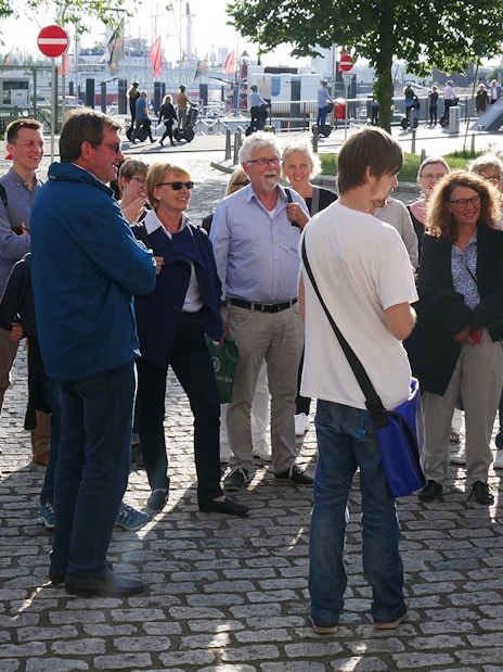 Group listening to a guide during Elbphilharmonie tour in Hamburg.