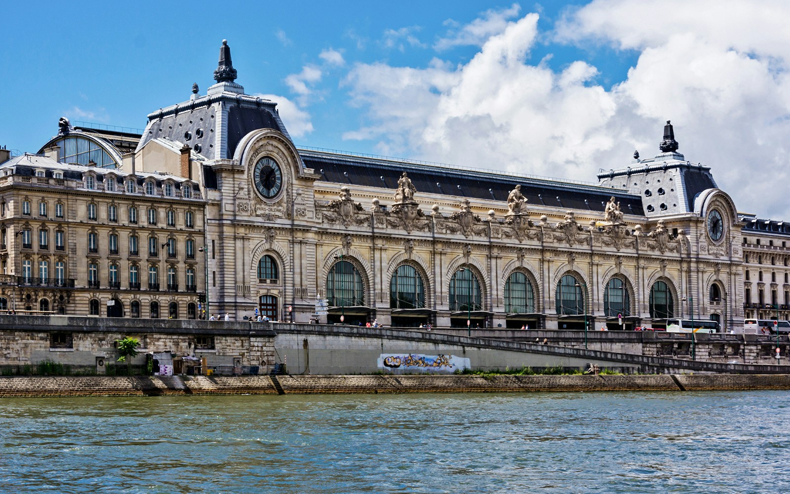 Orsay Musuem as seen from a river cruise with reflections in water.