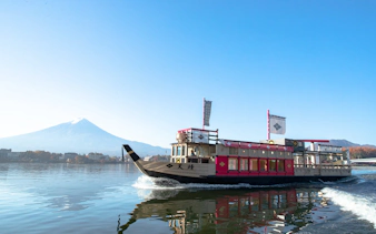 Cruise boat on Lake Kawaguchi with Mount Fuji in the background.