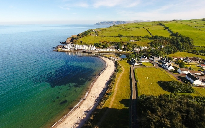 Aerial view of Cushendun village and coastline, Northern Ireland.