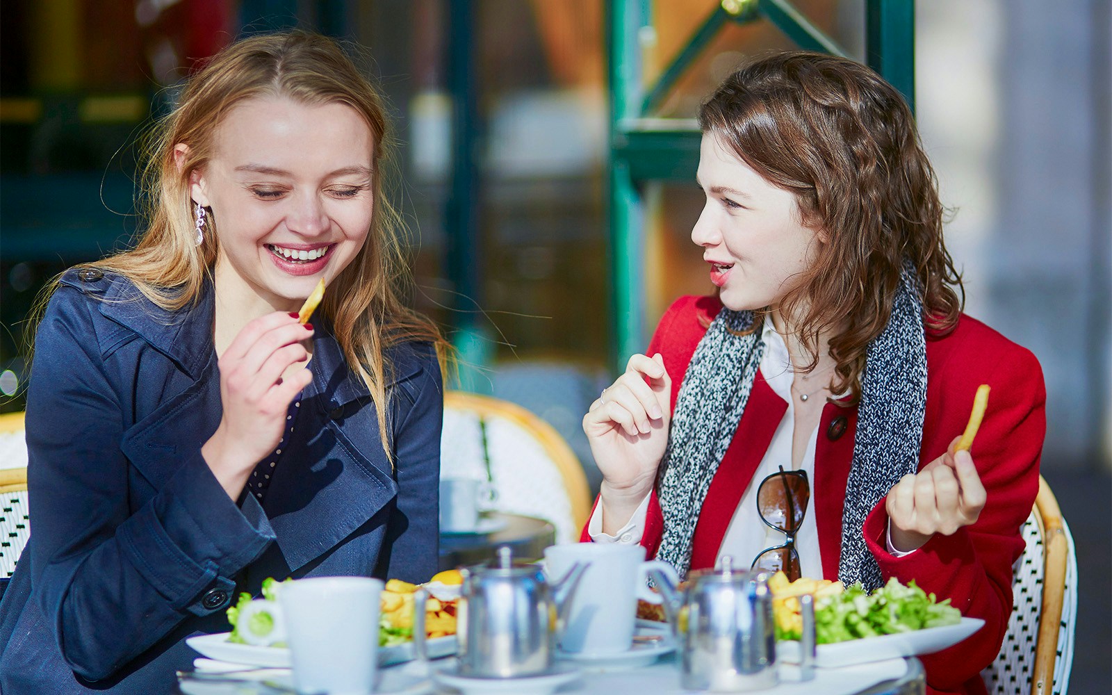 Visitors dining at cafes and restaurants near the Louvre Museum in Paris, France.