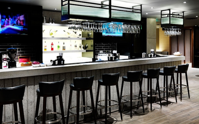 Bar area at Plaza Premium Lounge, Terminal 4, London Heathrow Airport.