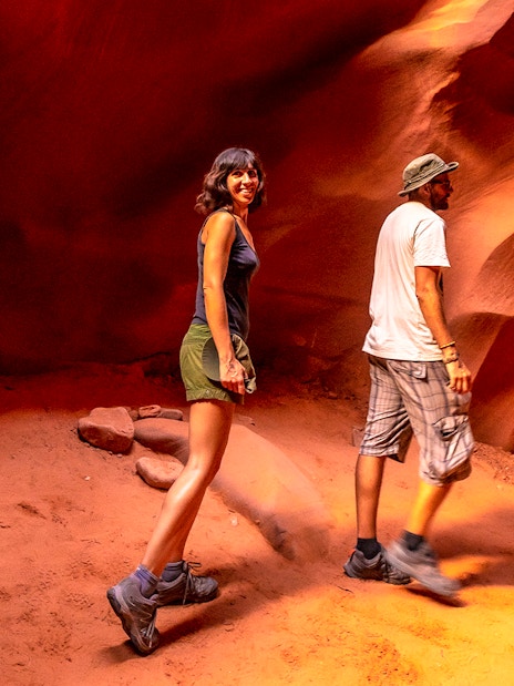 Young couple exploring Lower Antelope Canyon, Arizona.