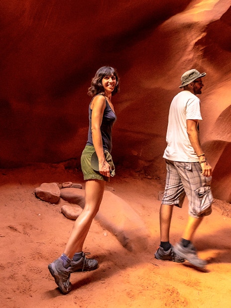 Young couple exploring Lower Antelope Canyon, Arizona.