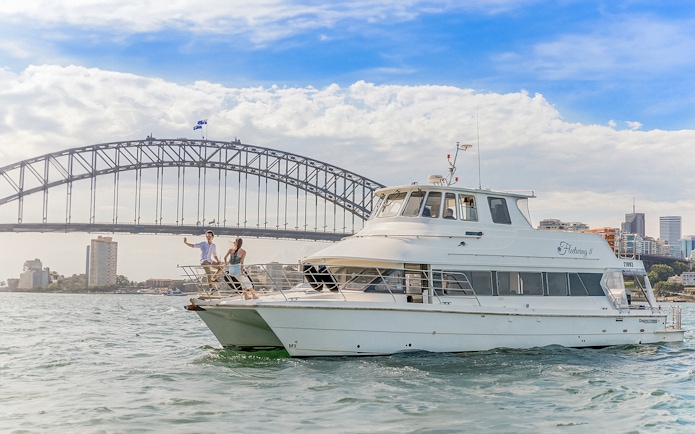 Cruise boat near Sydney Harbour Bridge during Vivid Sydney event.