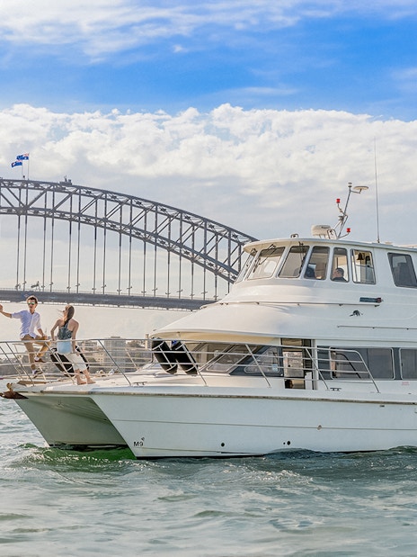 Cruise boat near Sydney Harbour Bridge during Vivid Sydney event.