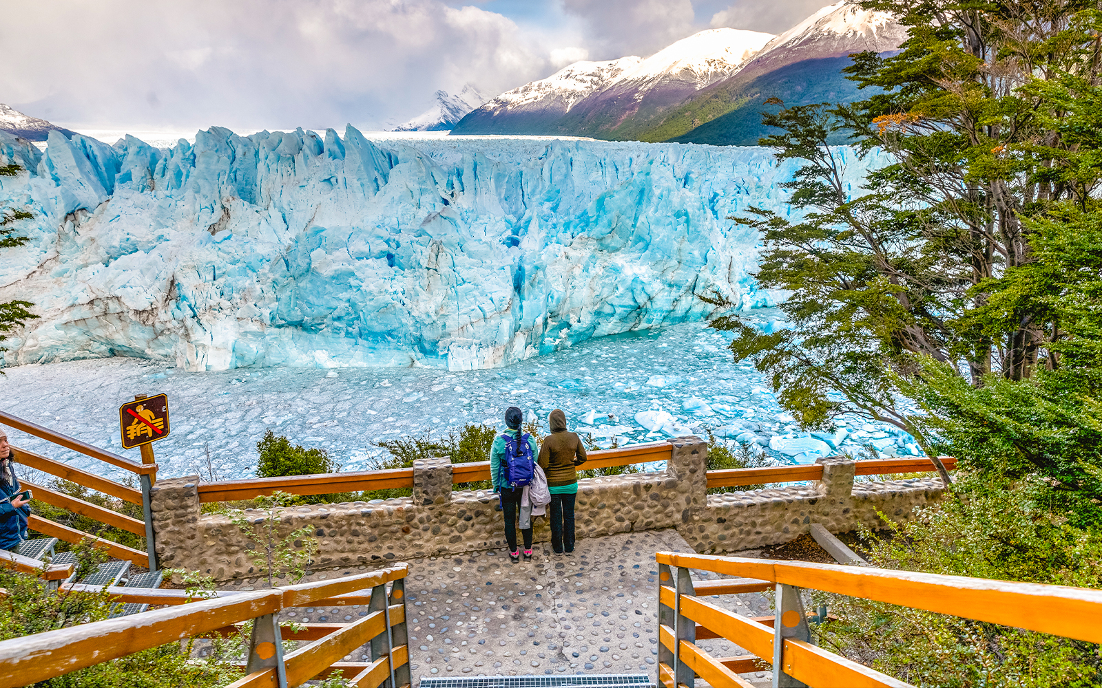 Visitors observing Perito Moreno Glacier from viewing deck in Patagonia, Argentina.