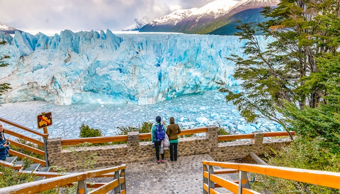 Visitors observing Perito Moreno Glacier from viewing deck in Patagonia, Argentina.