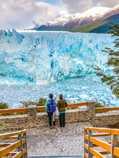 Visitors observing Perito Moreno Glacier from viewing deck in Patagonia, Argentina.