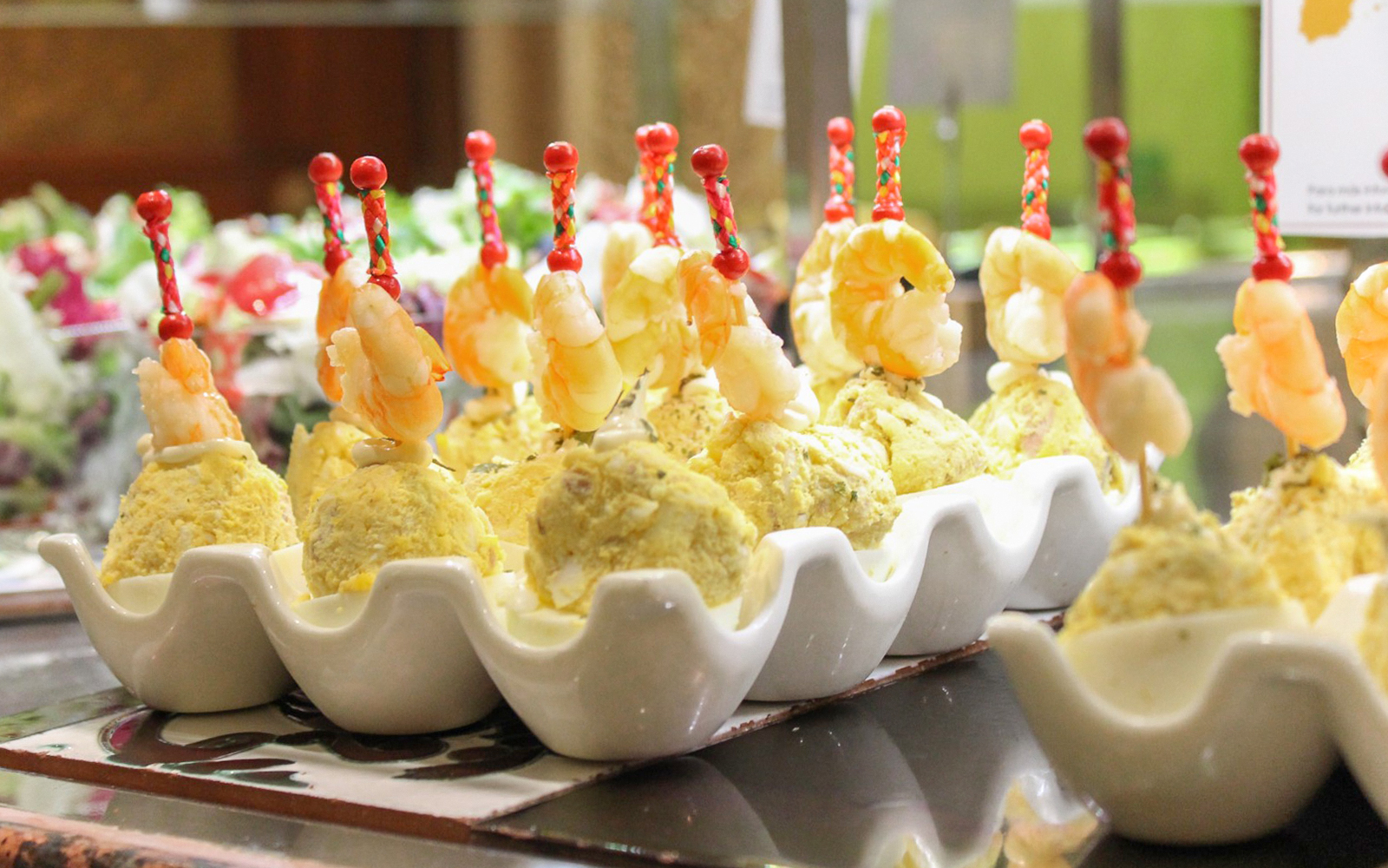 Shrimp skewers on potato salad at Tablao Cordobes buffet.