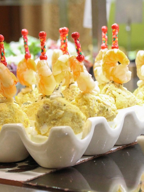Shrimp skewers on potato salad at Tablao Cordobes buffet.