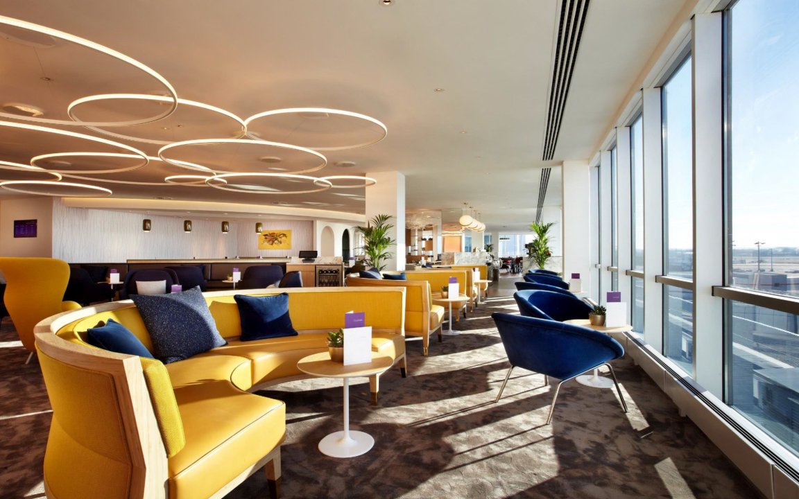 Plaza Premium Lounge seating area with large windows at London Gatwick Airport North Terminal.