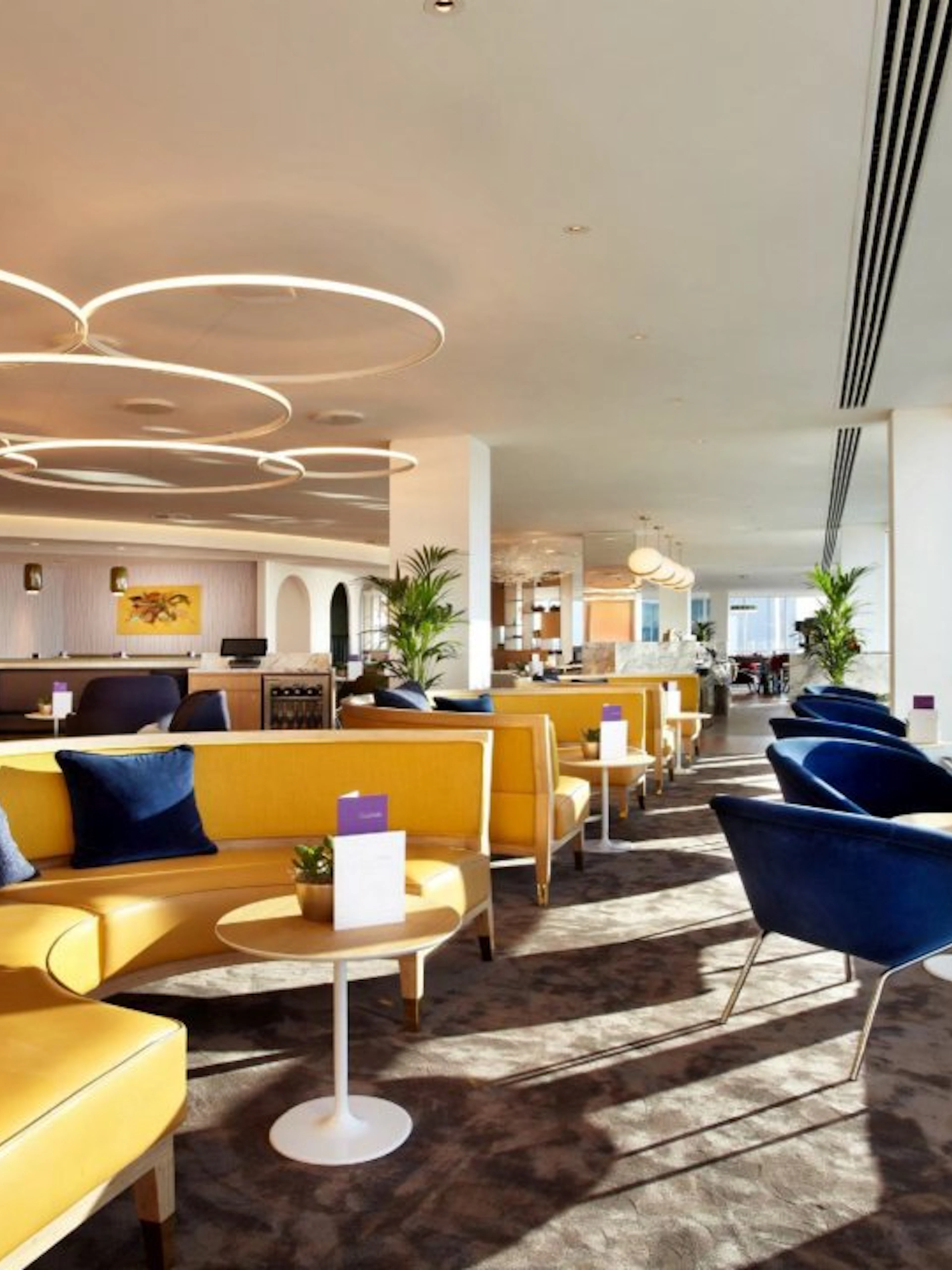 Plaza Premium Lounge seating area with large windows at London Gatwick Airport North Terminal.