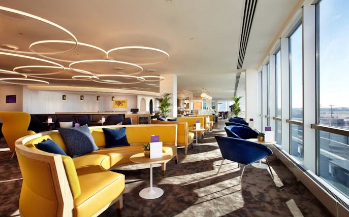 Plaza Premium Lounge seating area with large windows at London Gatwick Airport North Terminal.