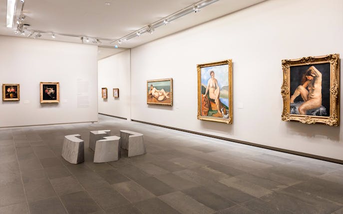 Paintings displayed inside Orangerie Museum gallery room.