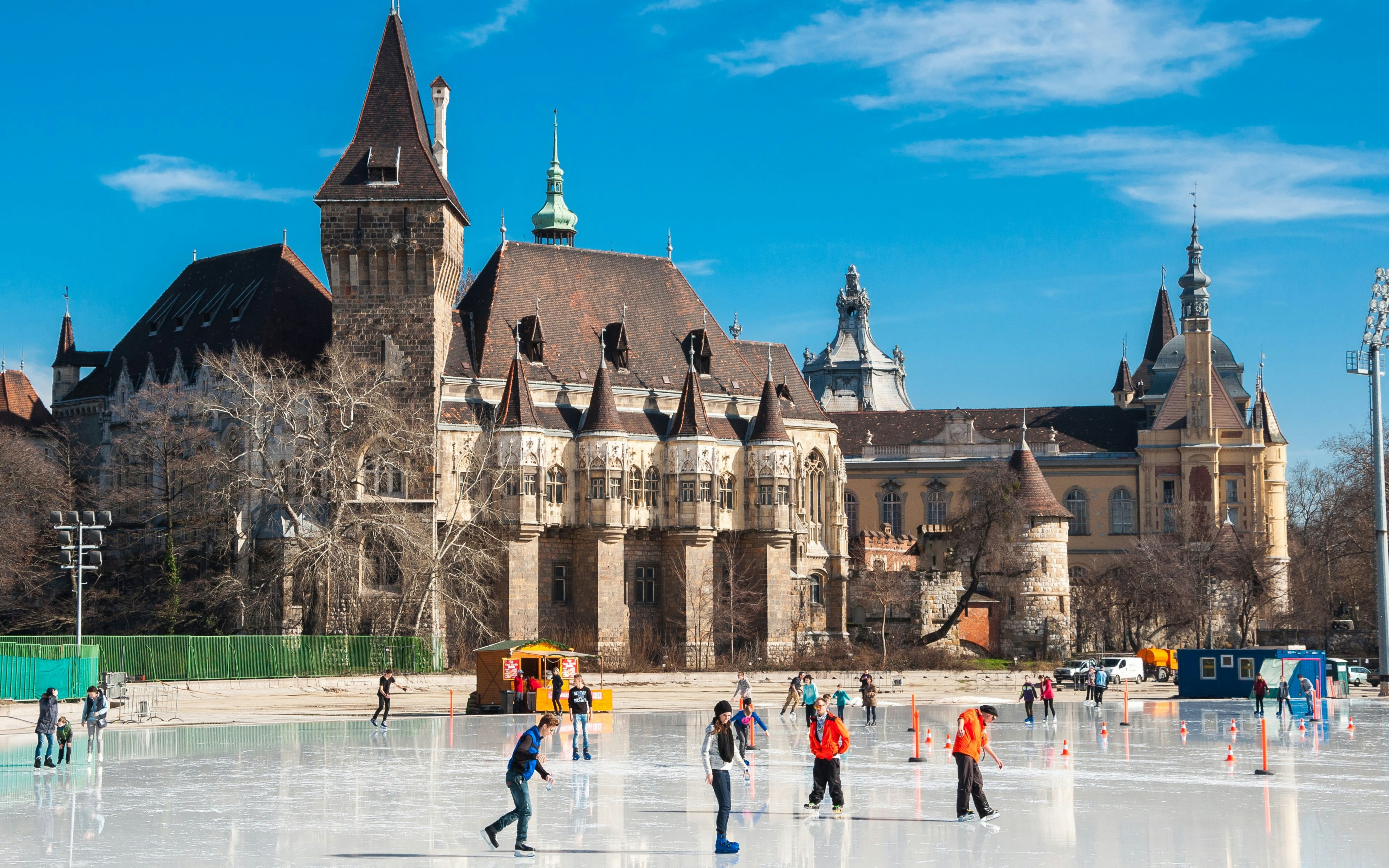 Skaters enjoying ice rink in front of Vajdahunyad Castle, Budapest, Hungary.