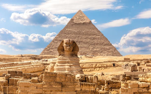 Sphinx and Pyramid of Giza under blue sky, Cairo day trip from Sharm Al Sheikh.
