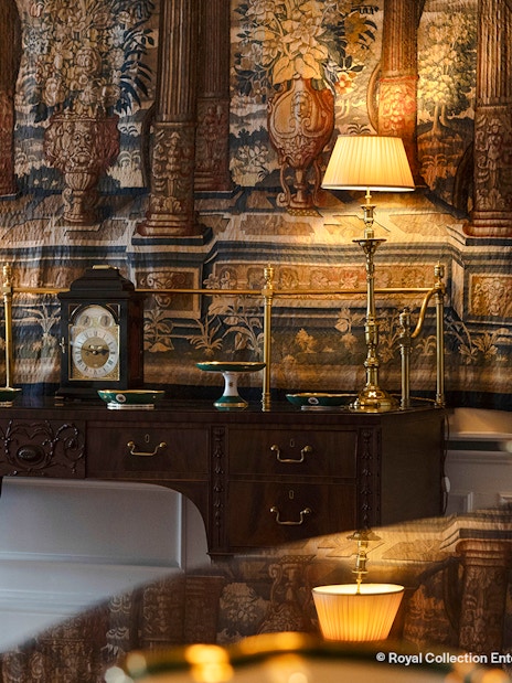 Antique desk with clock and lamps in Queen Elizabeth II Private Apartments, Palace of Holyroodhouse.