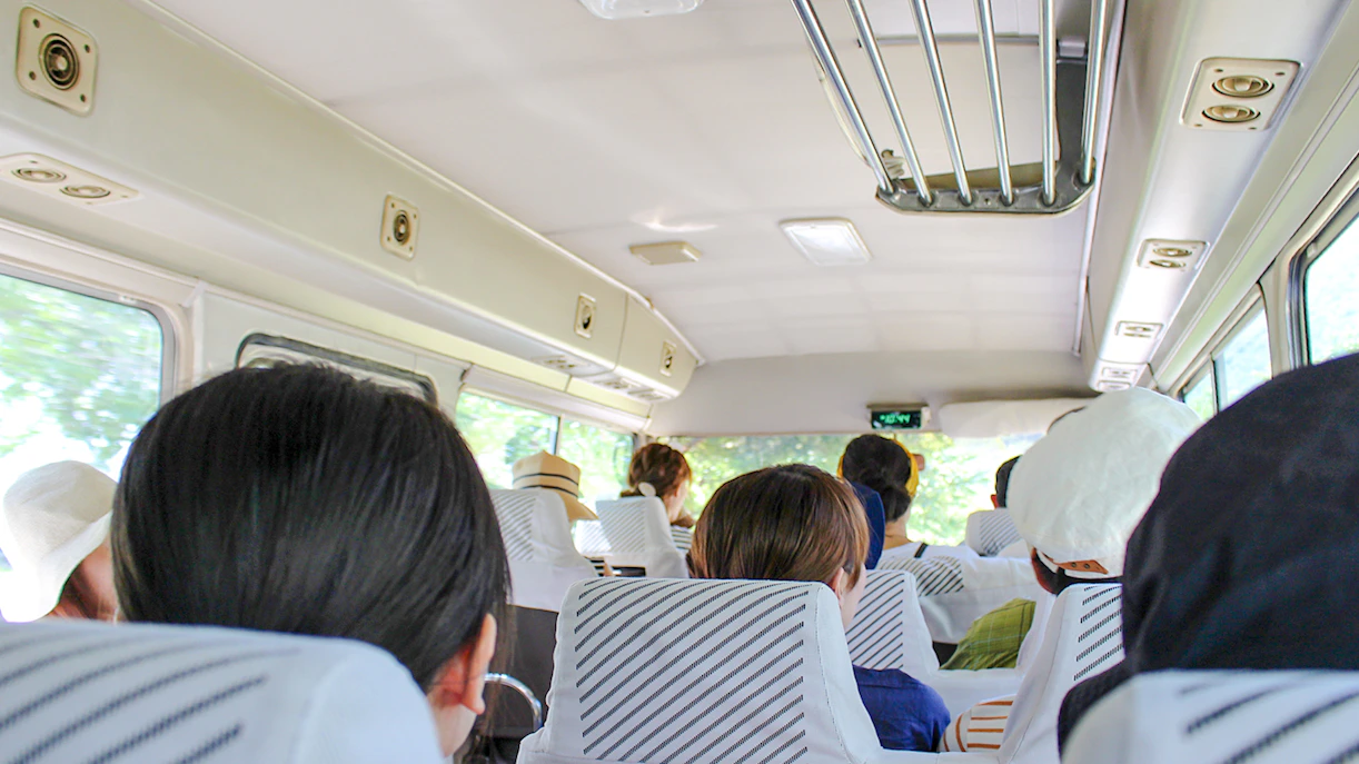 Passengers seated inside an AC minibus during Ksamil Islands day trip from Tirana.