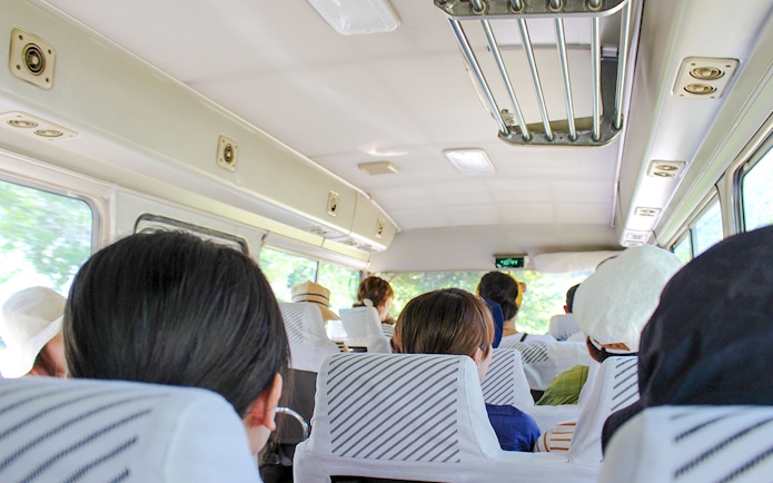 Passengers seated inside an AC minibus during Ksamil Islands day trip from Tirana.