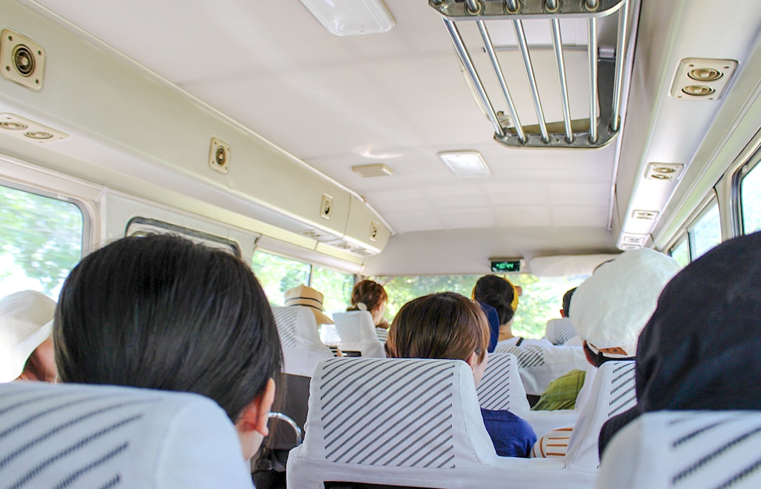 Passengers seated inside bus