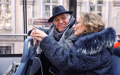 Elderly couple enjoying Istanbul hop-on hop-off bus tour.