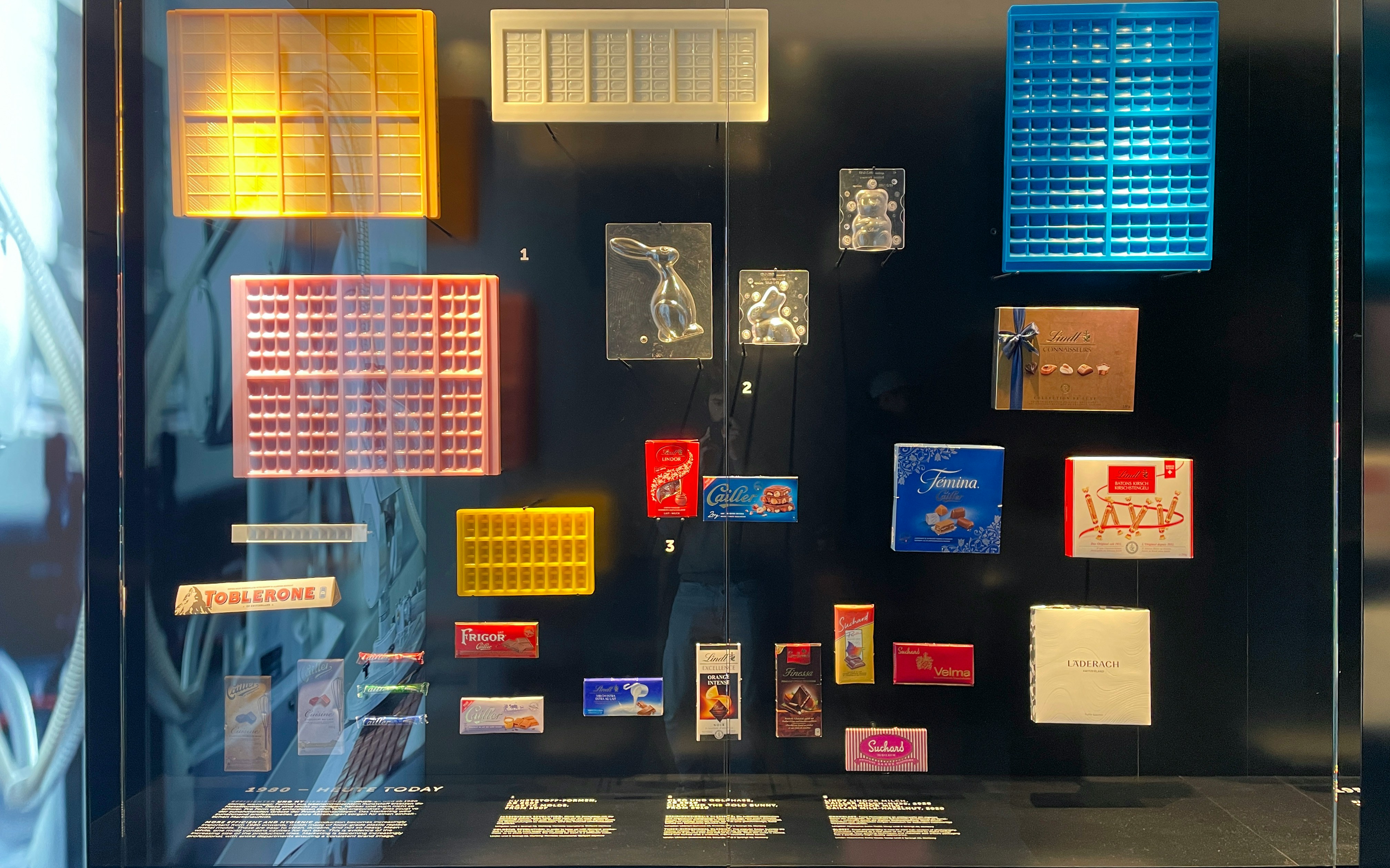 Chocolate molds and packaging display at Lindt Home of Chocolate Museum, Zurich.