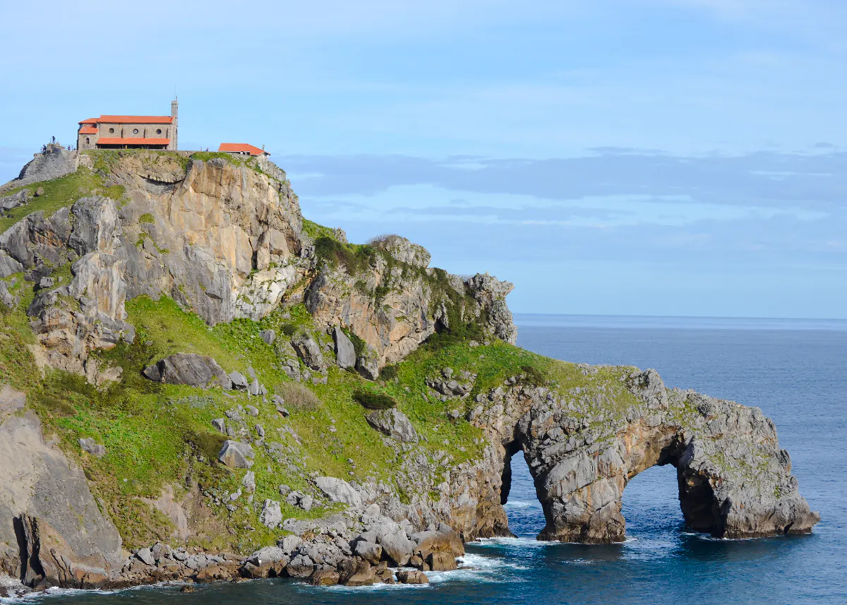 Church on rocky cliff at San Juan de Gaztelugatxe, near Bilbao, overlooking the ocean.