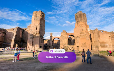 Visitors exploring the ancient ruins of the Baths of Caracalla in Rome.