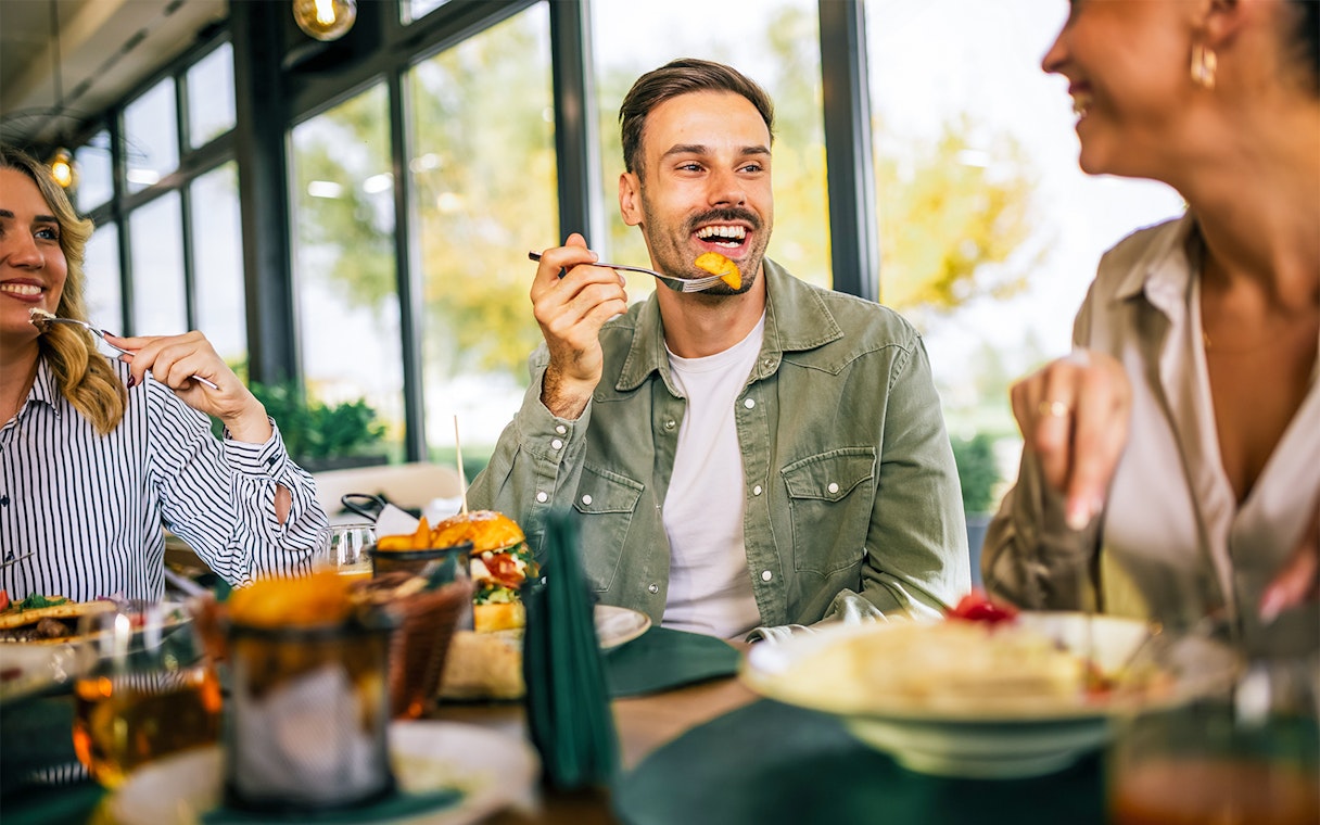 Brunch at Flora Danica Paris on Champs Elysées with friends enjoying a meal.