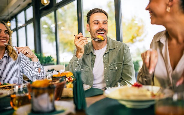 Brunch at Flora Danica Paris on Champs Elysées with friends enjoying a meal.