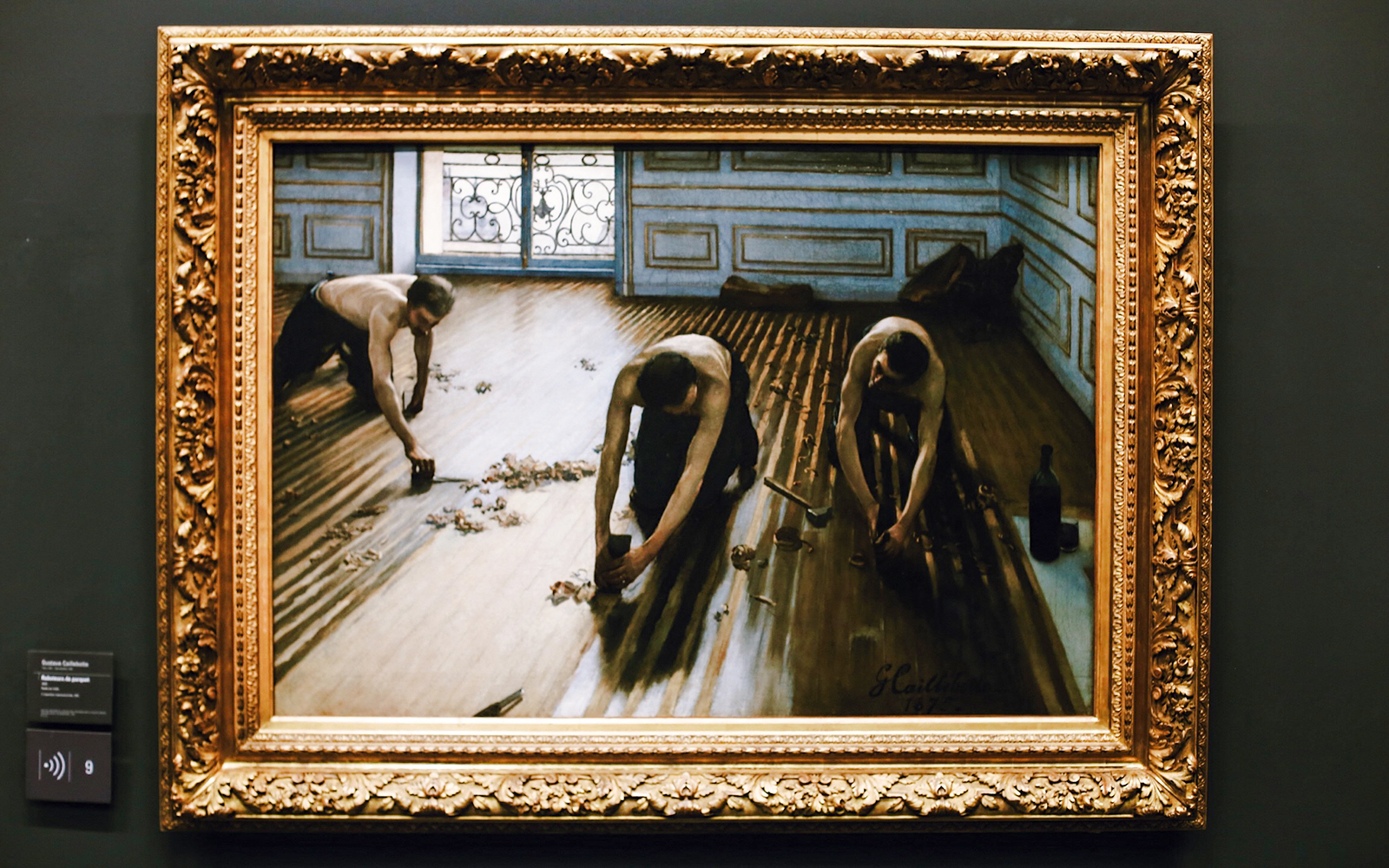 Painting of workers scraping a wooden floor, displayed in Orsay Museum, Paris, France.